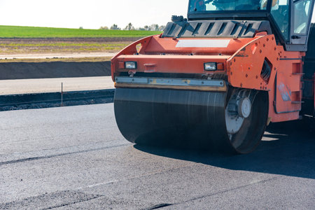Road rollers building the new asphalt road