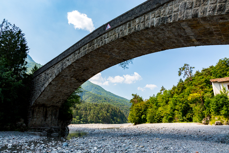 Old bridge over the river Tagliamento in Italyの写真素材