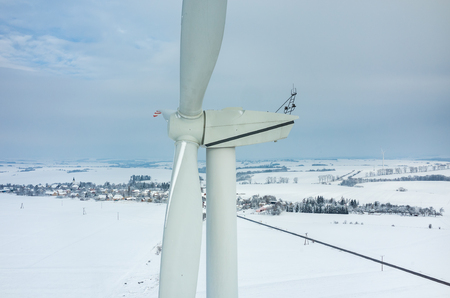 Aerial view on the windmill on the field in winter seasonの写真素材