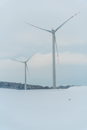 Large view on the windmill on the field in winter seasonの写真素材