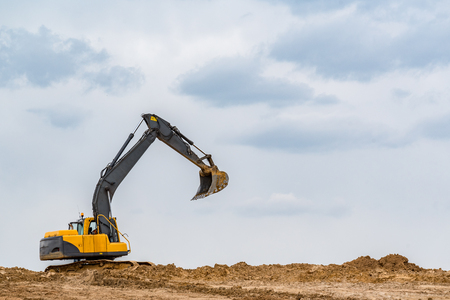 Large view on the excavator working on the construction siteの写真素材