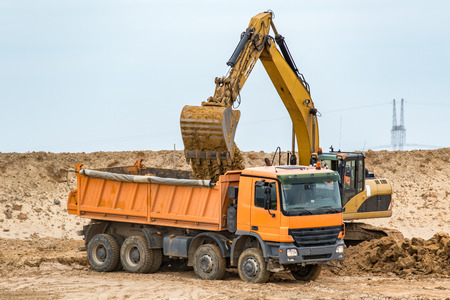 Large view on the excavator working on the construction siteの写真素材