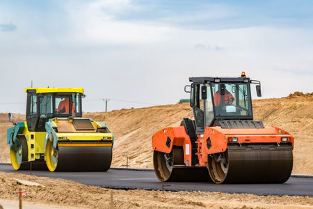 Road rollers building the new asphalt road