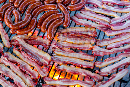 Close view on the sausages and bacon grilledのeditorial素材