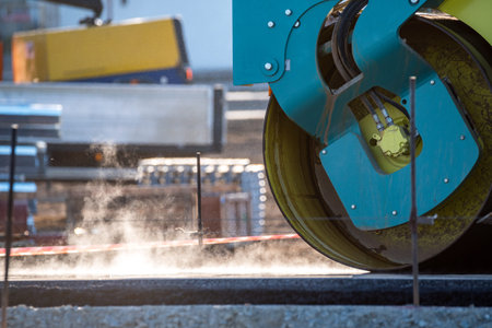 Close view on the road roller working on the new road construction site