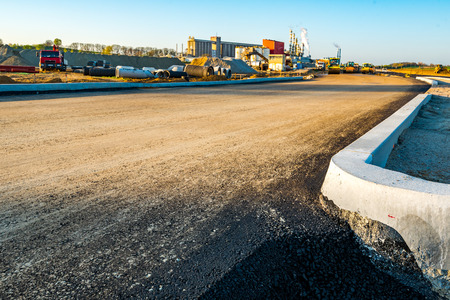 Large view on the road rollers working on the new road construction siteの写真素材