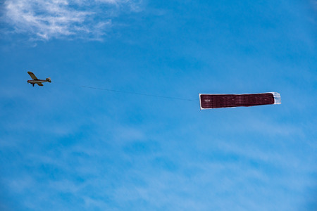 Large view on the small plane with advertising bannerの写真素材