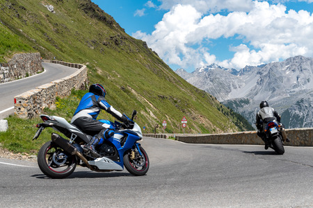 Close view on motorbike on the famous road in mountains Alps Passo Stelvioの写真素材