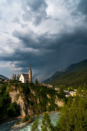 Large view on the small church in mountains Alpsの写真素材
