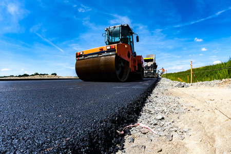 Close view on the road roller working on the new road construction site