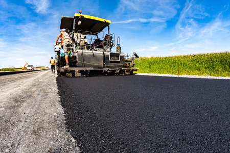 Large view on the road rollers working on the new road construction site