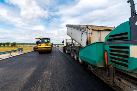 Close view on the road roller working on the new road construction site