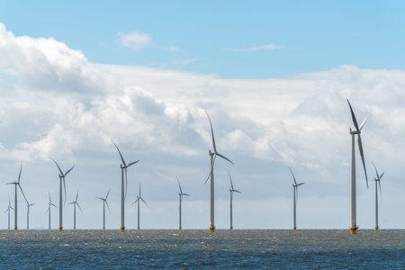 Large view on the windmills in the ocean