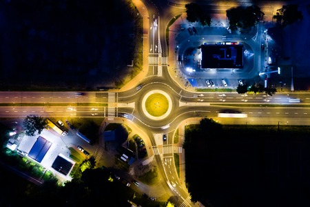 Aerial view on the crossroad in the city in the nightの写真素材