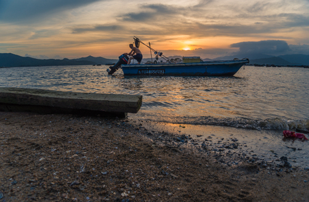 boat at the sea while sunsetのeditorial素材