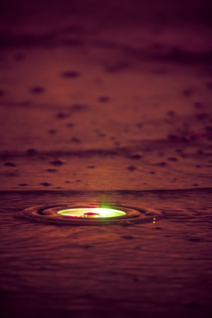 colorful light and dust stand on the raining situationの写真素材