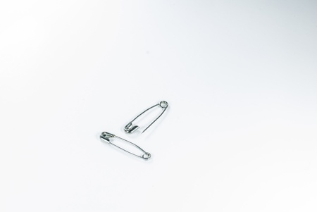 Safety pin - isolated - Two safety pins over white background - の写真素材
