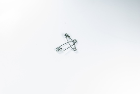 Safety pin - isolated - Two safety pins over white background - の写真素材