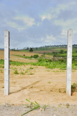 Barbed wire fence in verticalの写真素材