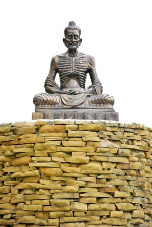 skeleton ascetic statue sit on the wall brick with white backgroundの写真素材