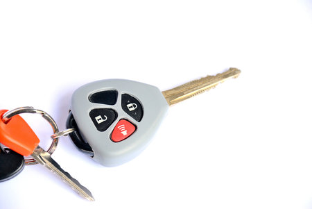 Car key with remote buttons on white background - Car ignition key with remote control