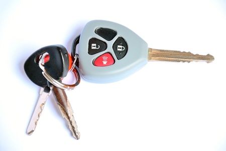 Car key with remote buttons on white background - Car ignition key with remote controlの写真素材