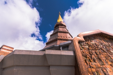 Huge pagoda against beautiful cloud and blue sky - Wide angle view of One Pillar Pagodaの写真素材