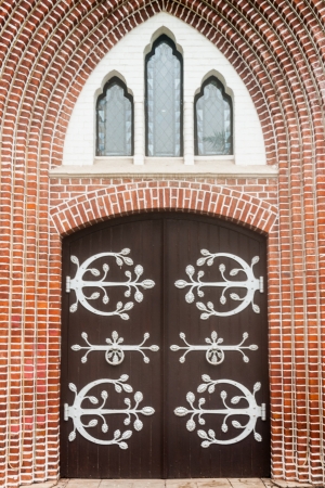 Entrance wood door - old wooden house or church Door - Old armored doorway の写真素材
