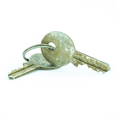 Old and rusty key isolated on white backgroundの写真素材