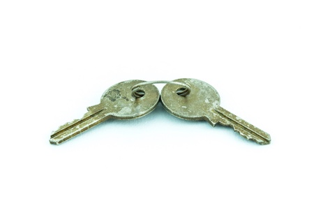 Old and rusty key isolated on white backgroundの写真素材