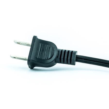 Electric plug - power plug - Black electric cable isolated on whiteの写真素材