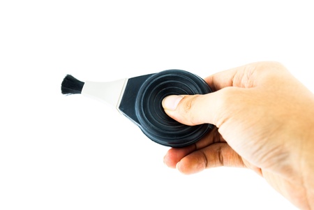 Blower brush isolated at the white background - Blower brush for cleaning lenses and cameras - black brush for photo cameraの写真素材