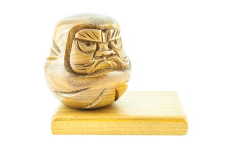 angry wooden doll on the wooden plate - wooden doll on a white backgroundの写真素材