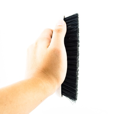 Cleaning brush for toilet in hand isolated on whiteの写真素材