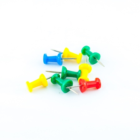 pins in different colors - collection of various pushpins on white backgroundの写真素材