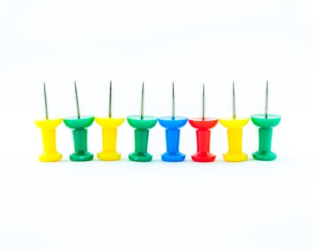 pins in different colors - collection of various pushpins on white backgroundの写真素材