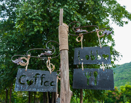 direction signpost of coffee lobby dining room with arrows in parkの写真素材