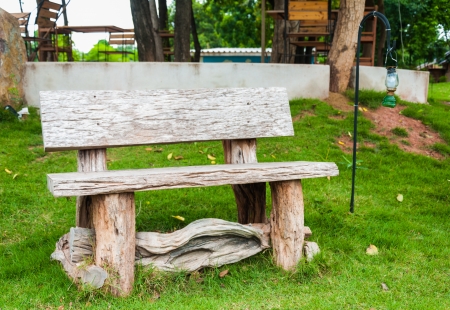 Wooden chair with lamp in the garden or parkの写真素材