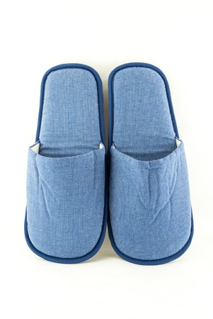 Household blue slippers isolated on white backgroundの写真素材