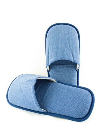 Household blue slippers isolated on white backgroundの写真素材