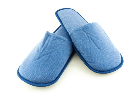 Household blue slippers isolated on white backgroundの写真素材