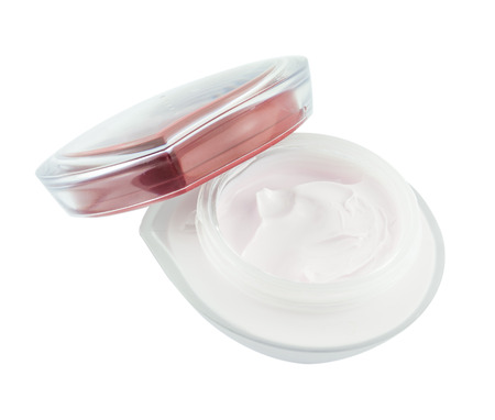 Opened plastic container with face cream isolated on whiteの写真素材