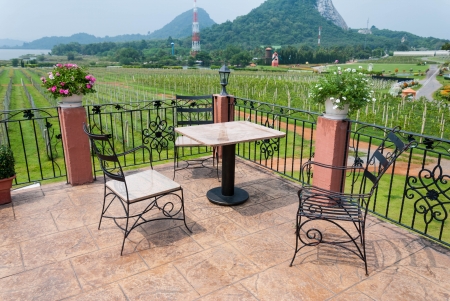 Outdoor table and chair garden furniture with nature viewの写真素材