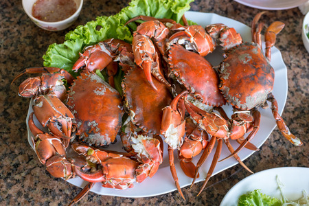 Hot steamed red crab prepare to eat on a plateの写真素材