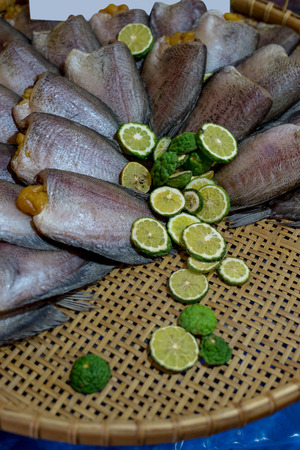 Dried Sepat Siam or Snakeskin gourami with Kaffir lime to protect fishy smellの写真素材