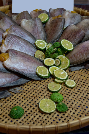 Dried Sepat Siam or Snakeskin gourami with Kaffir lime to protect fishy smellの写真素材