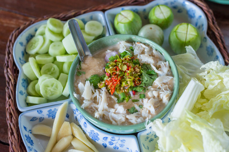 Stew crab with coconut milk dip sauce with fresh vegetablesの写真素材