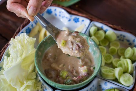 Stew crab with coconut milk dip sauce with fresh vegetables