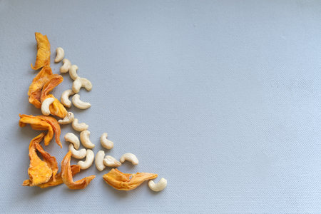 Roasted cashew nuts on gray background. top view with copy spaceの写真素材