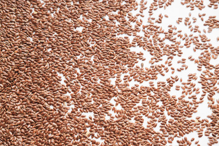Flax seeds on white background. selective focus. toned.
